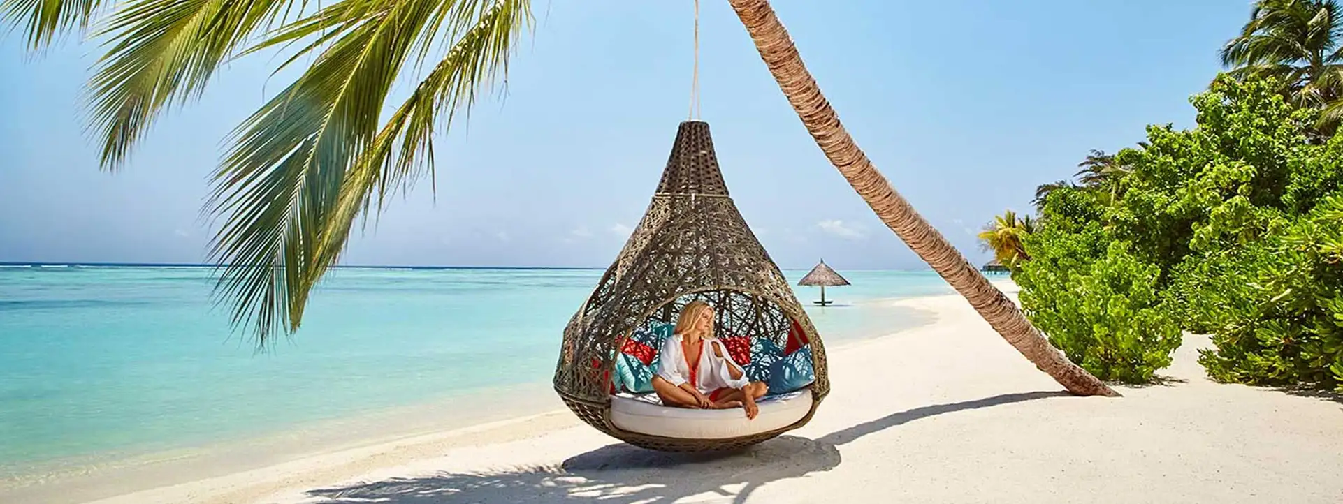 LUX-SOUTH-ARI-ATOLL-Maldives-girl-in-hammock-on-beach